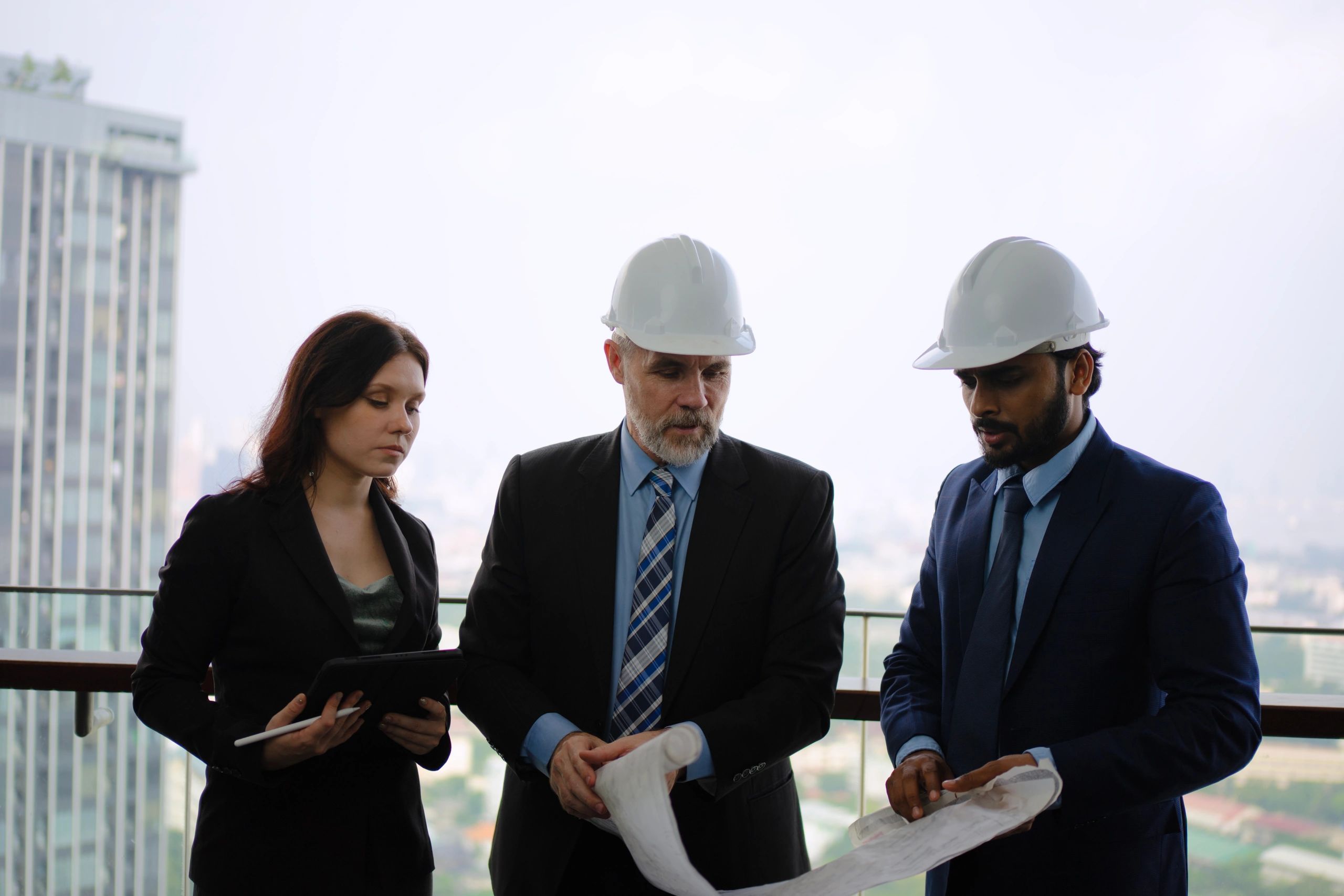 Project management team working on construction documentation